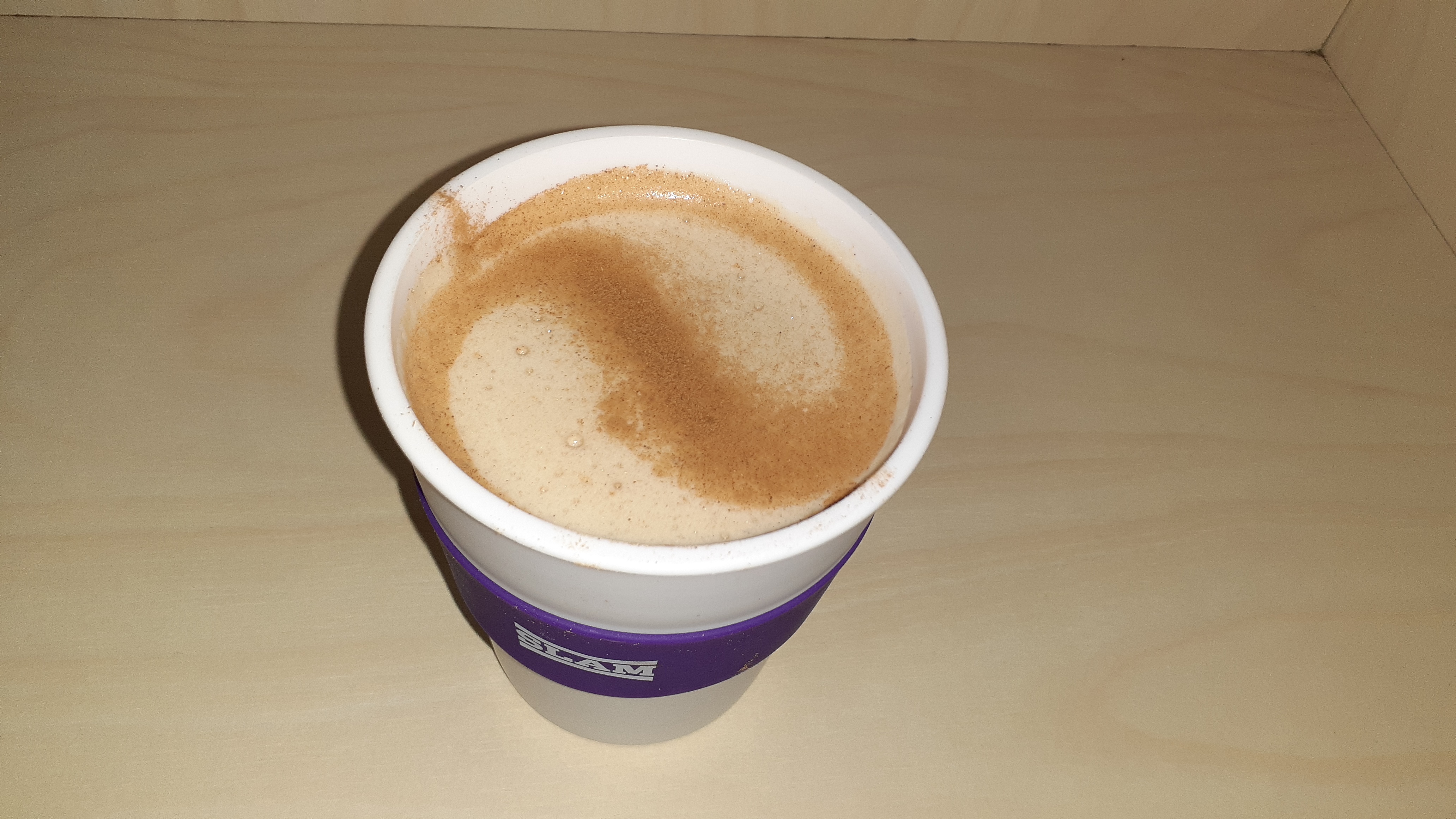 A chai latte in a keep cup